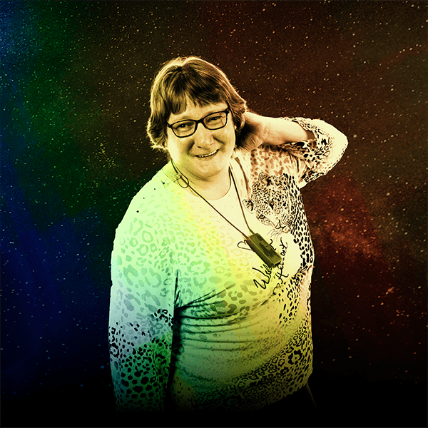 Middle-aged ensemble member, Colleen Ashmore, posing with a slight lean and her left hand behind her head against a star background. The image is treated with a rainbow gradient that matches the Robot Revelations album artwork.